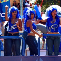 Blue girls dancing on a parade float